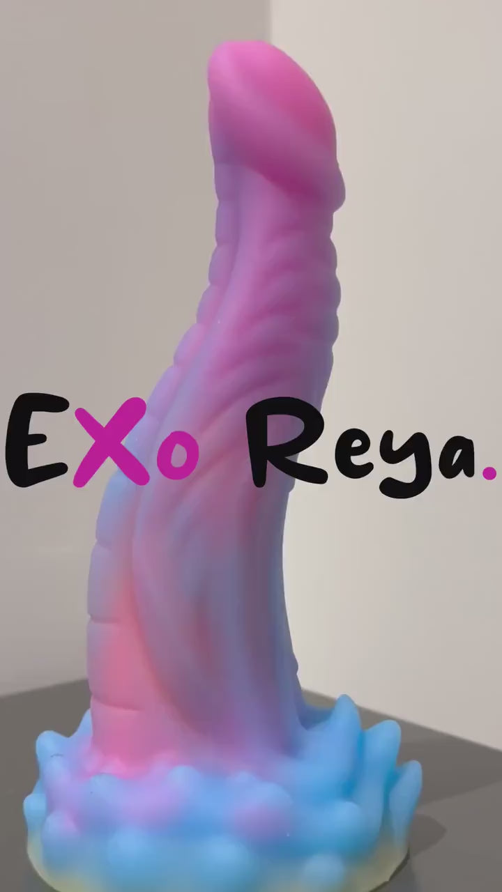 Glow in the dark pink dragon dildo with elegant cloud details by Exo Reya