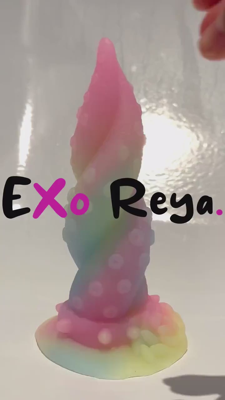 Softer rainbow twisted tentacle dildo with sucker details that glows in the dark